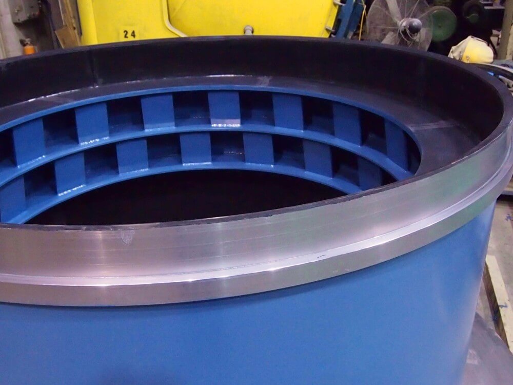 Trunnion liner feed end bearing